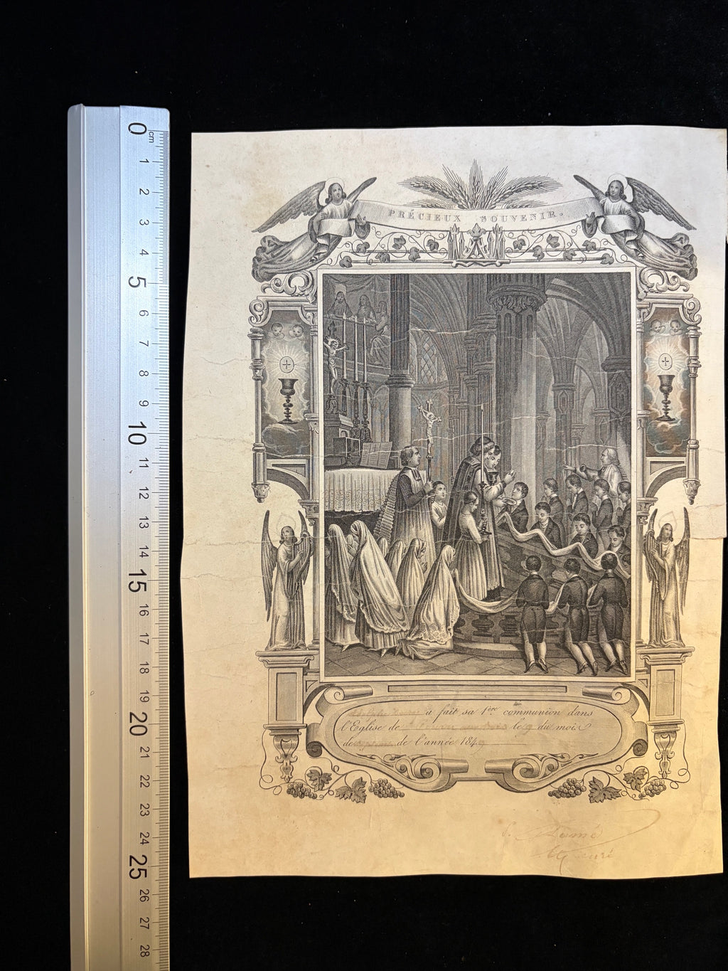 1840s Precieux Souvenir First Communion certificate next to a ruler showing its size, about 18 x 26.5 cm