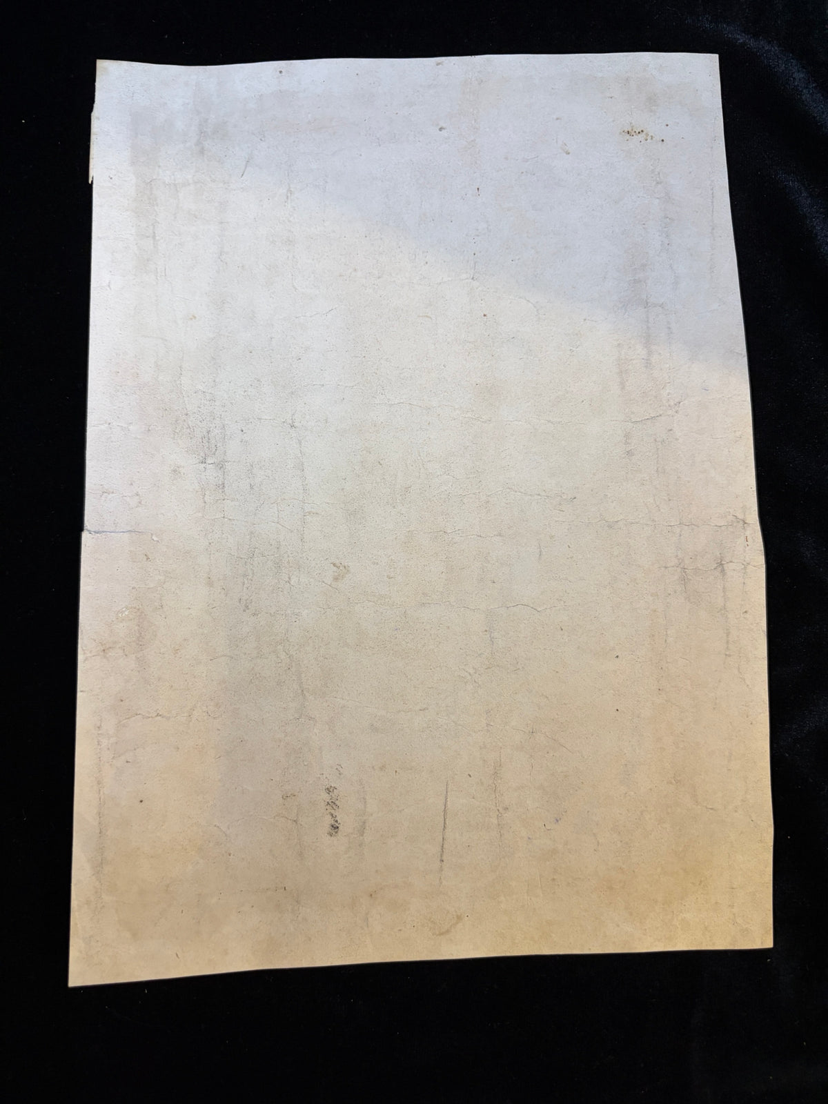 Reverse of the 1840s First Communion certificate showing old folds, toning and spotting