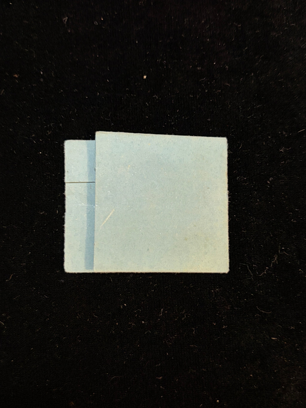 Back of the folded blue paper relic packet of Anne Catherine Emmerich