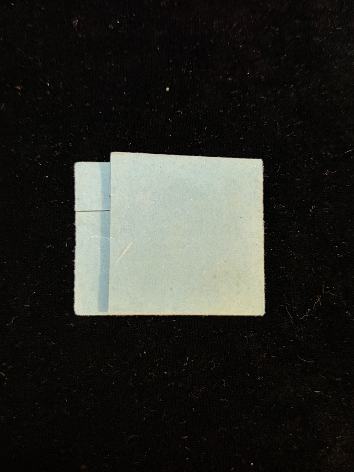 Back of the folded blue paper relic packet of Anne Catherine Emmerich