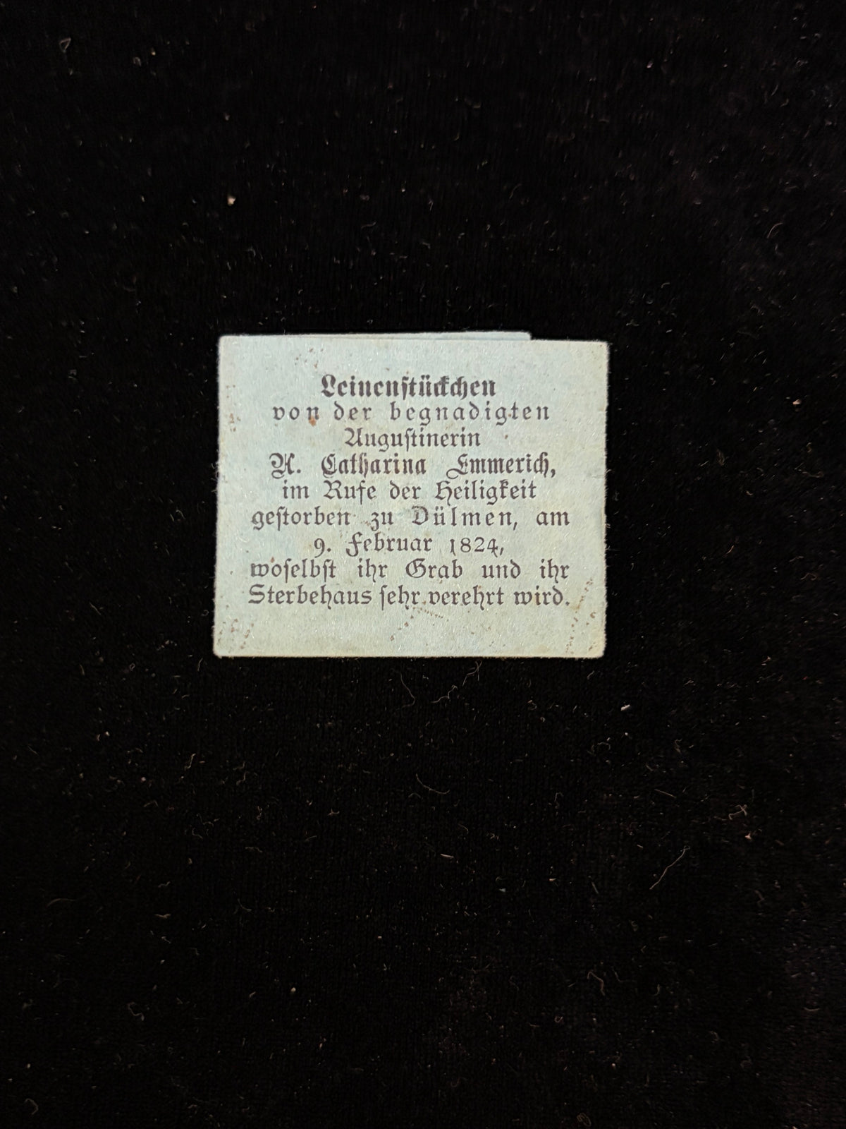 Antique blue paper relic packet of Blessed Anne Catherine Emmerich printed in German Fraktur, Leinenstueckchen, Duelmen 1824