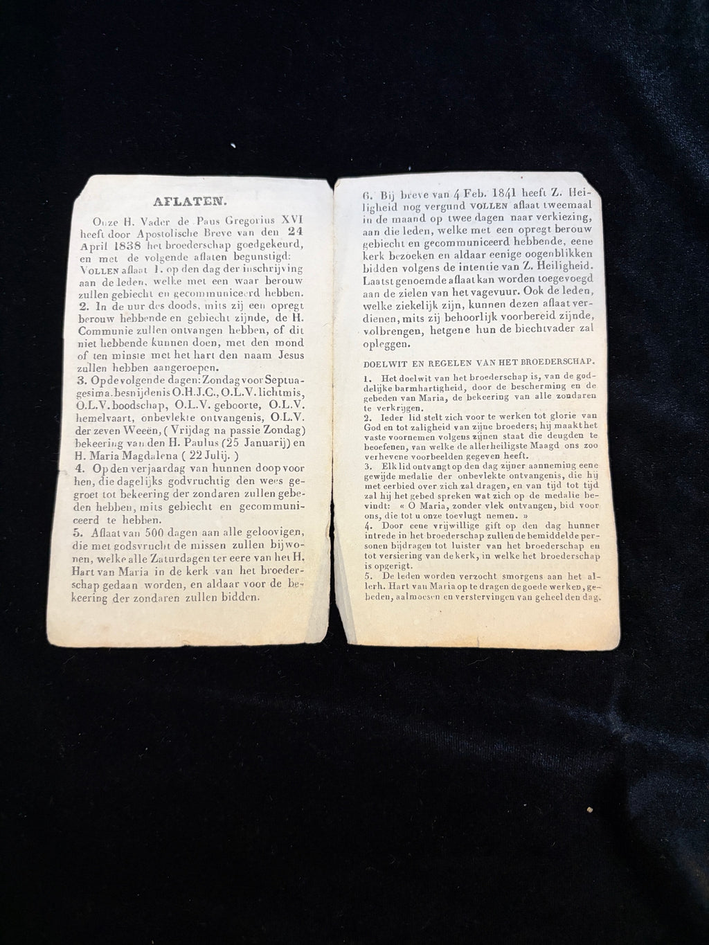 Inside pages of the 1840s confraternity certificate listing indulgences granted by Pope Gregory XVI and the rules of the confraternity, in Dutch