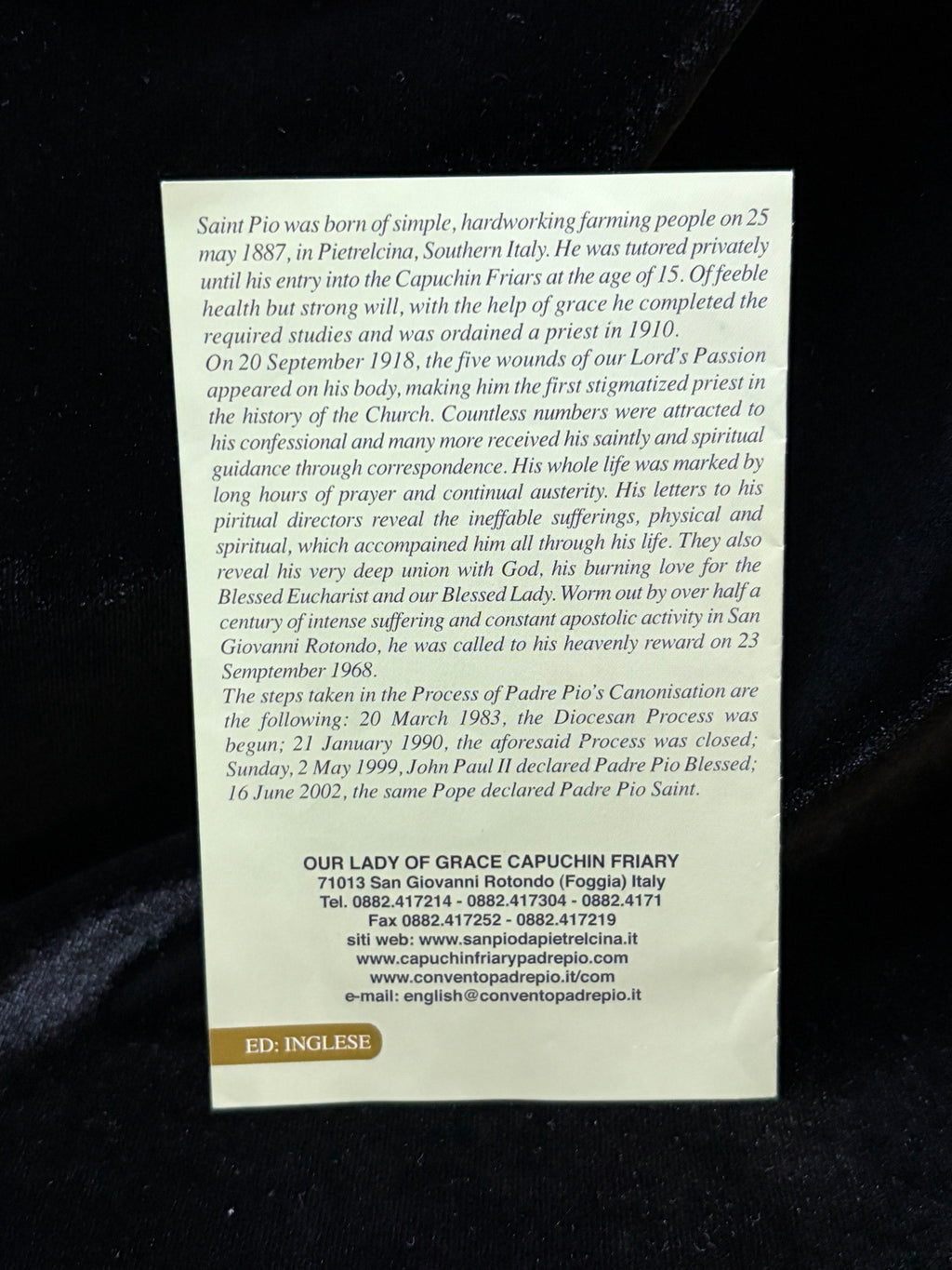 Back of Padre Pio relic card with biography of Saint Pio and address of Our Lady of Grace Capuchin Friary, English edition