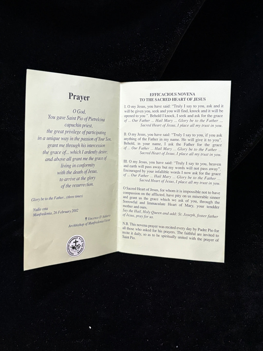 Inside of Padre Pio relic card with prayer to Saint Pio, Postulator General seal and Novena to the Sacred Heart of Jesus