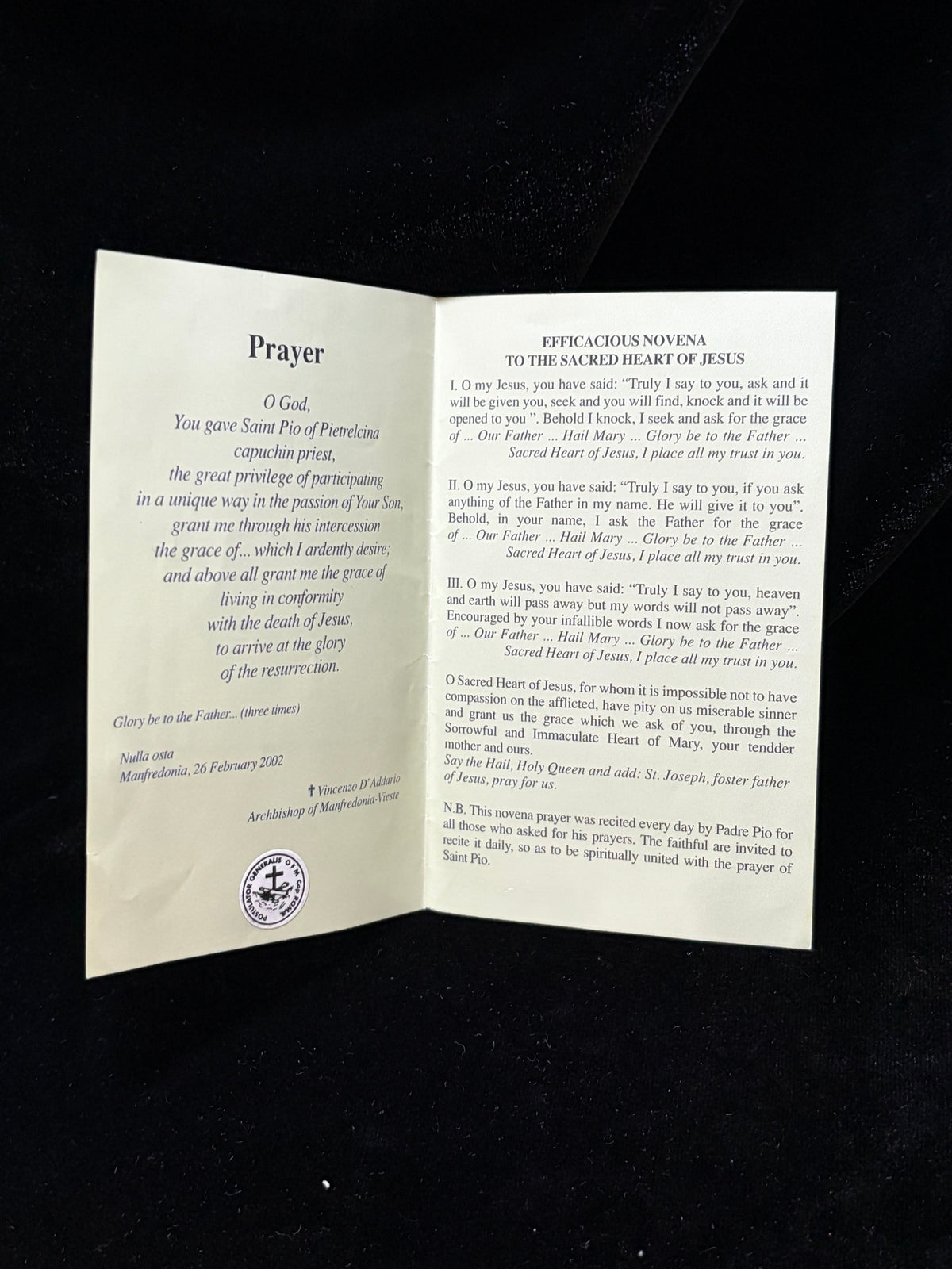 Inside of Padre Pio relic card with prayer to Saint Pio, Postulator General seal and Novena to the Sacred Heart of Jesus