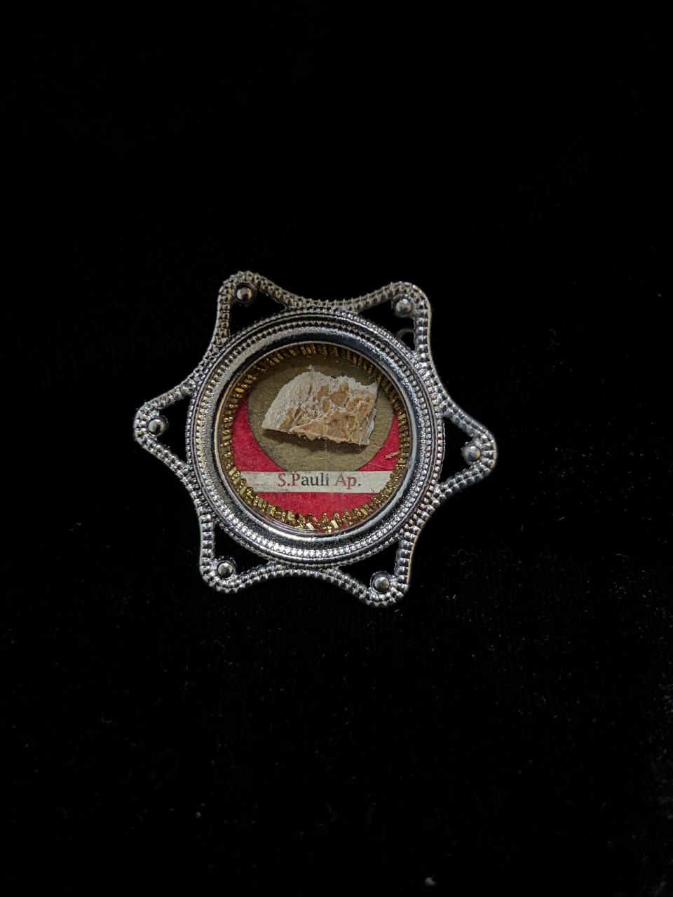 Saint Paul the Apostle relic in a silver star-shaped theca, label S. Pauli Ap., small on black velvet