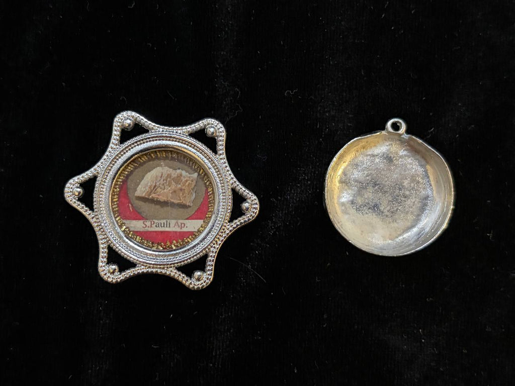 Saint Paul star theca beside its silver back cover