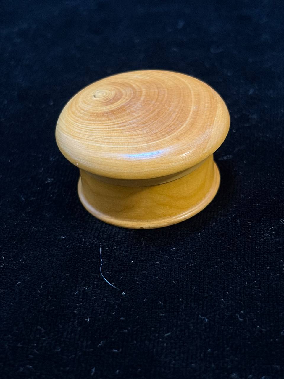 Closed round wooden theca of the Saint Catherine of Siena relic, side view