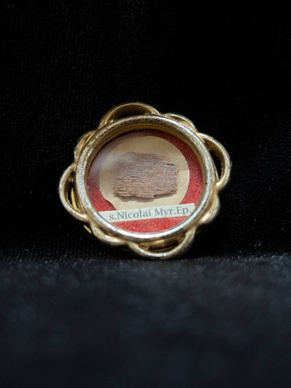 Saint Nicholas of Myra first-class relic in a gilt quatrefoil theca, label S. Nicolai Myr. Ep., angled view