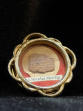 Saint Nicholas of Myra first-class relic in a gilt quatrefoil theca, label S. Nicolai Myr. Ep., front view