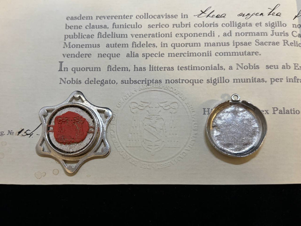Red wax seal on the back of the Saint Anthony star theca beside the certificate