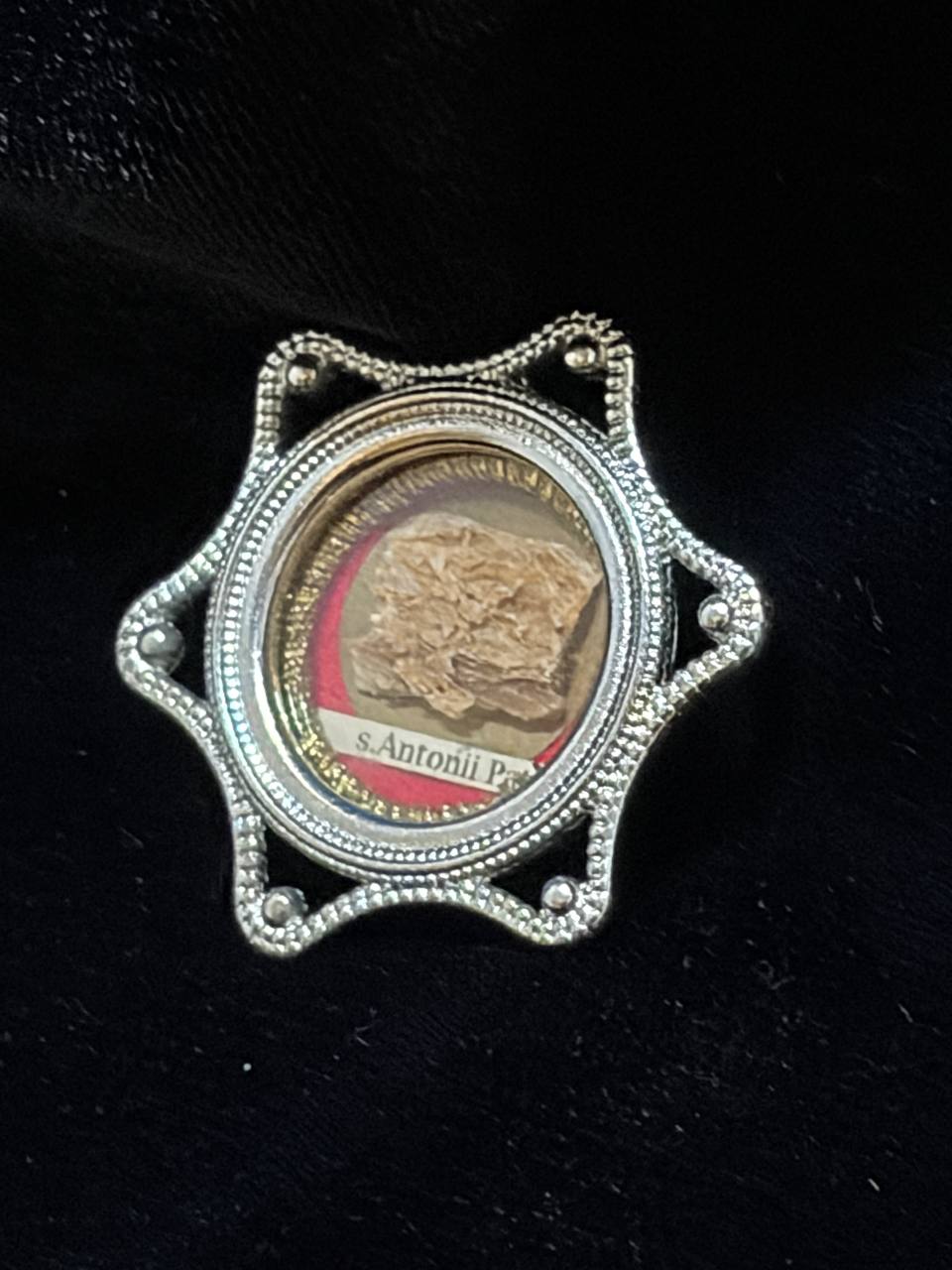 Saint Anthony of Padua relic in a silver star-shaped theca, label S. Antonii Pat., side view