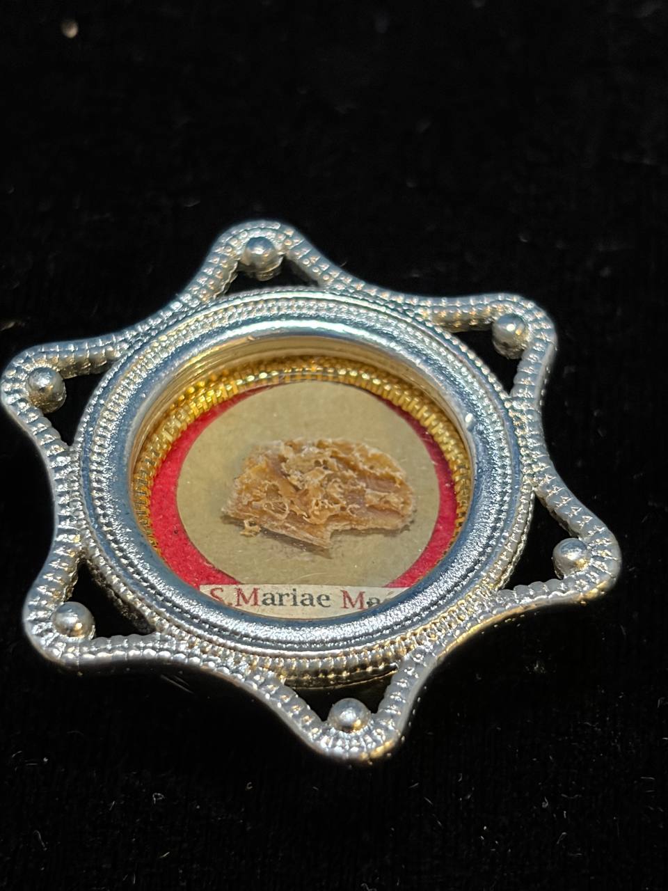 Saint Mary Magdalene relic in a silver star-shaped theca, label S. Mariae Magd., front view