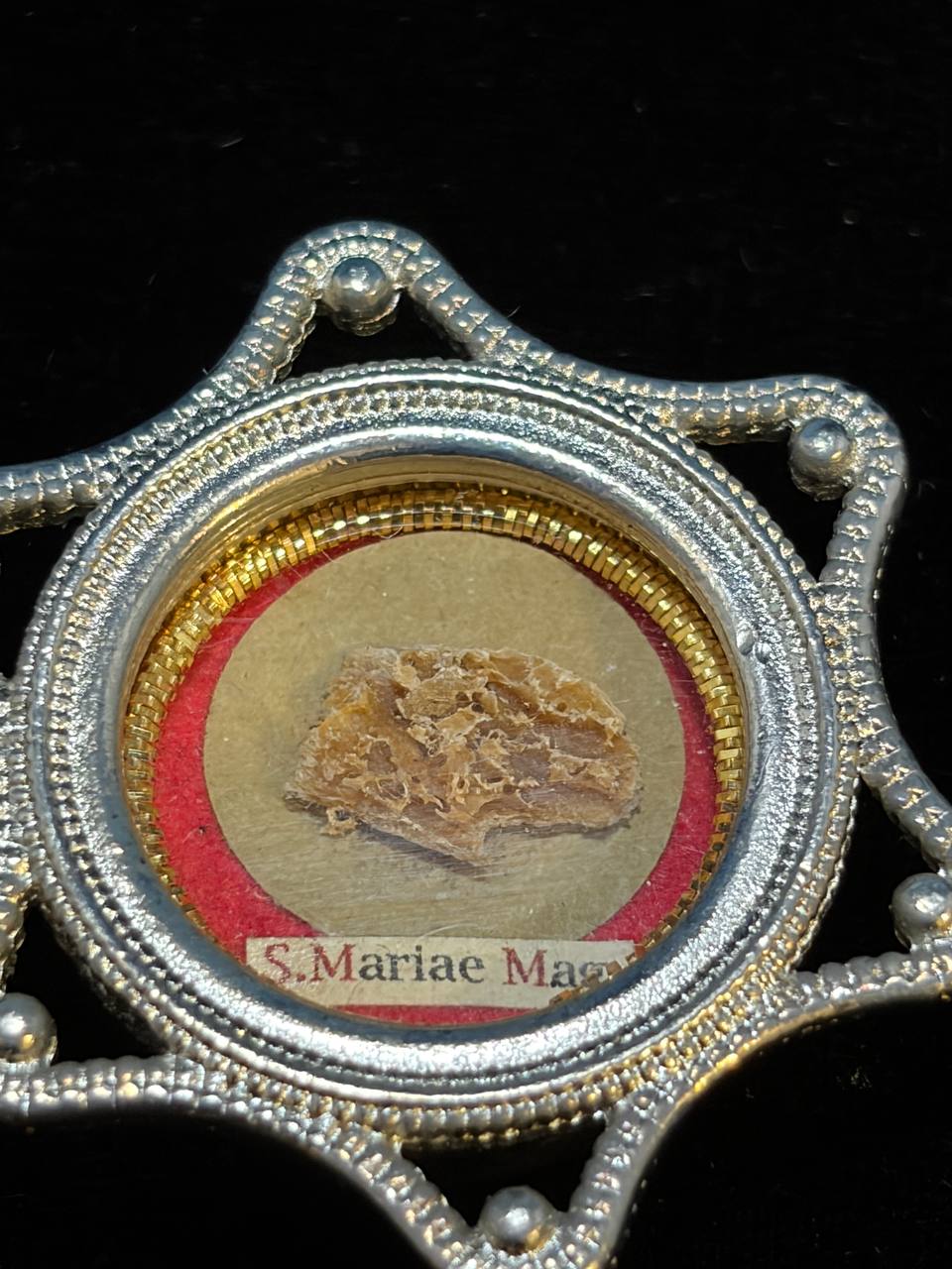 Saint Mary Magdalene relic in a silver star-shaped theca, label S. Mariae Magd., close-up