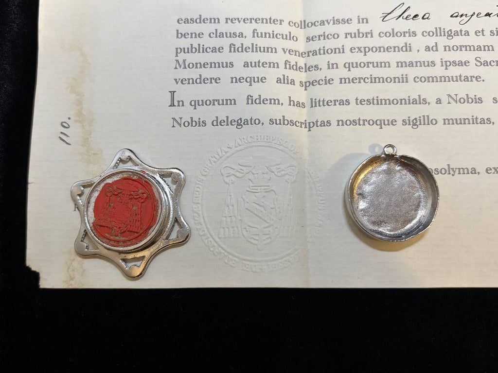Red wax seal on the back of the Saint Anne star theca beside the certificate
