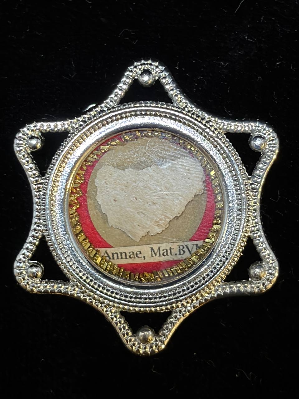 Saint Anne relic in a silver star-shaped theca, label S. Annae Mat. B.V.M., front view