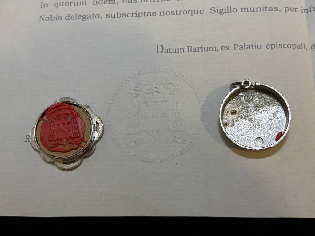 Red wax seal on the back of the Saint Demetrius theca beside the certificate