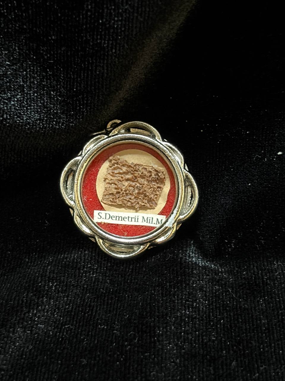 Saint Demetrius of Thessaloniki relic in a silver quatrefoil theca, label S. Demetrii M., on black velvet