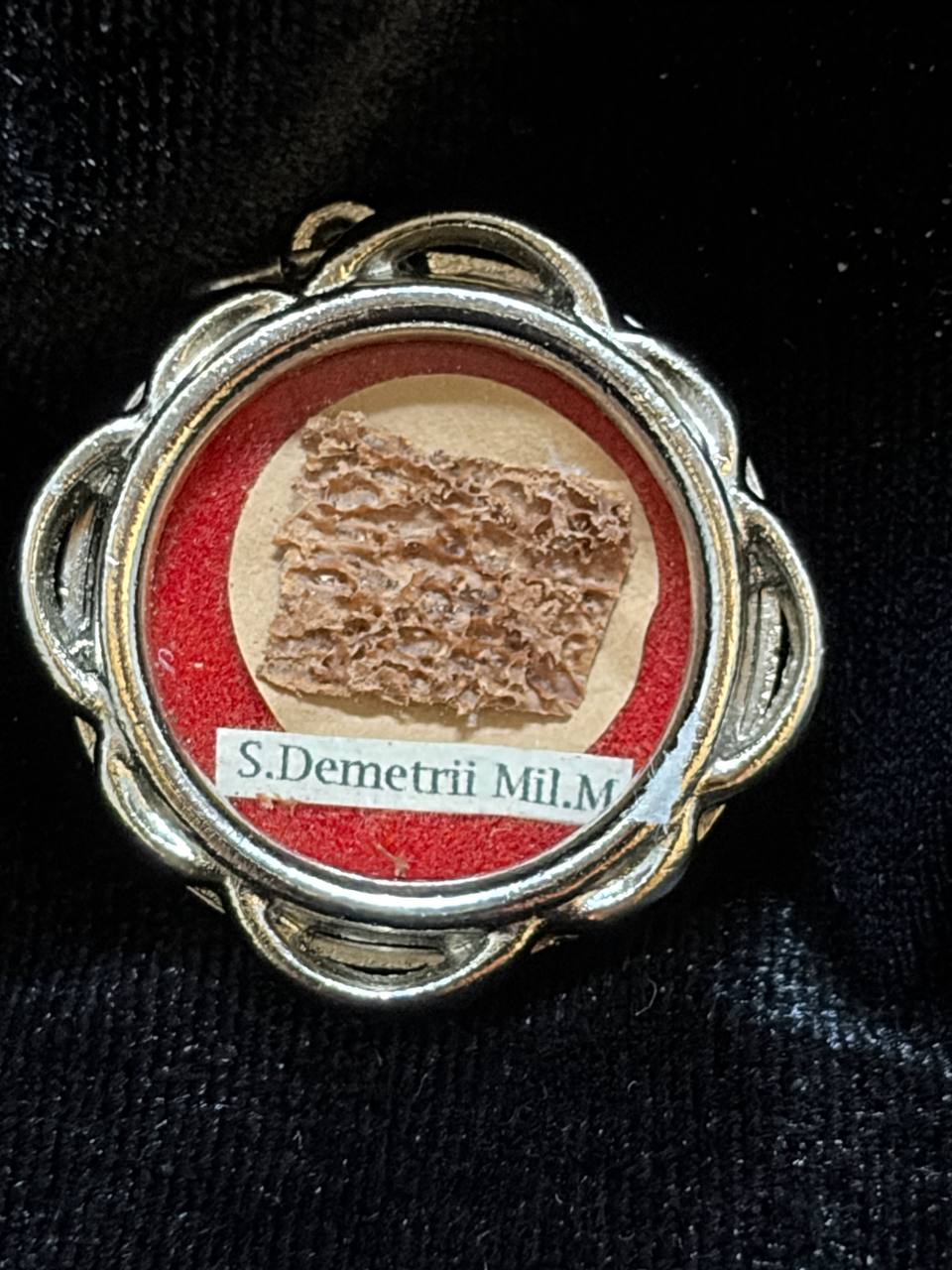 Saint Demetrius of Thessaloniki relic in a silver quatrefoil theca, label S. Demetrii M., close-up of the bone relic