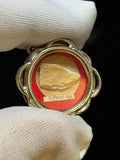 Saint Peter the Apostle relic in a silver quatrefoil theca, label S. Petri Ap., held in a white glove