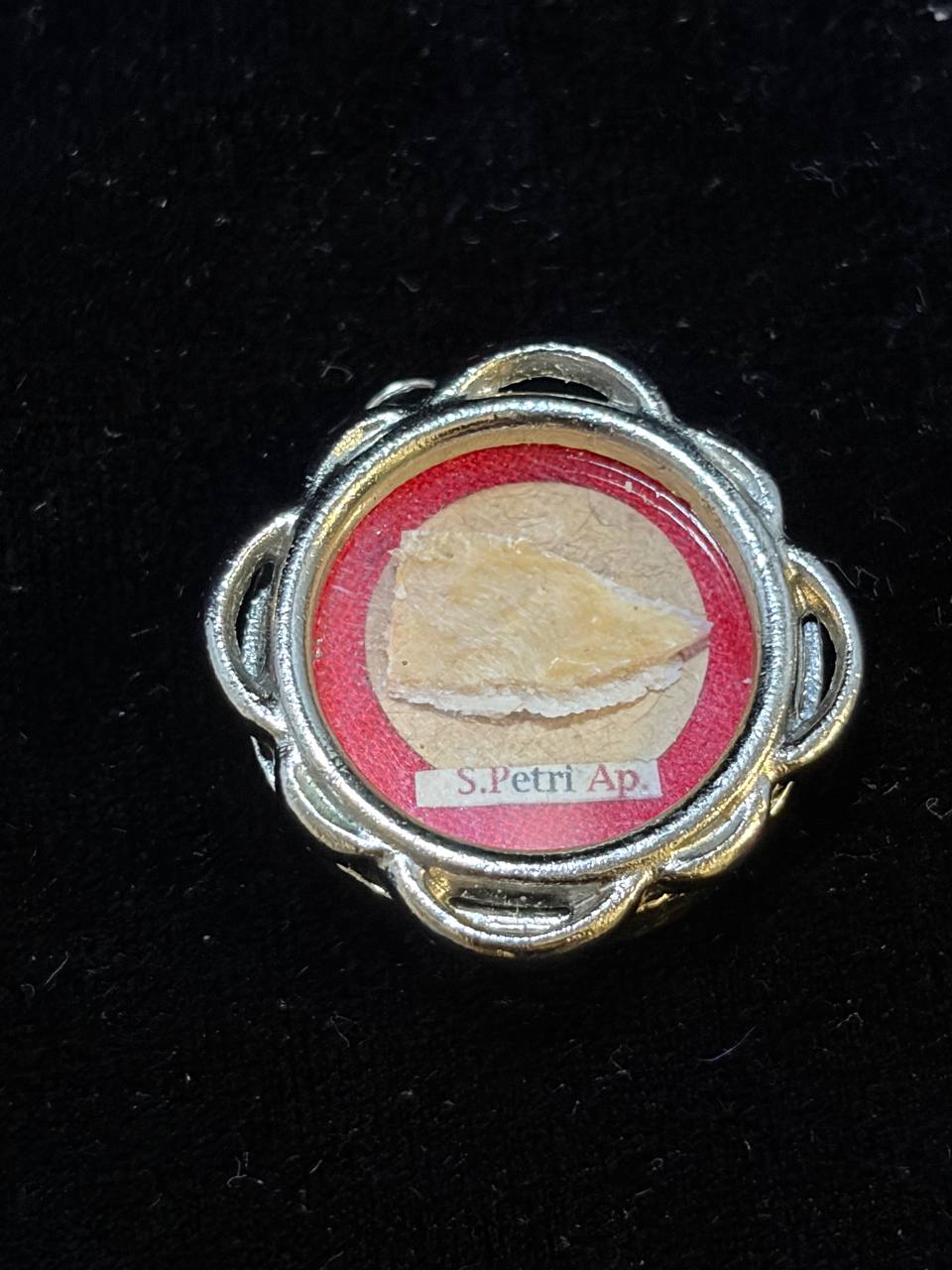 Saint Peter the Apostle relic in a silver quatrefoil theca, label S. Petri Ap., front view on black velvet
