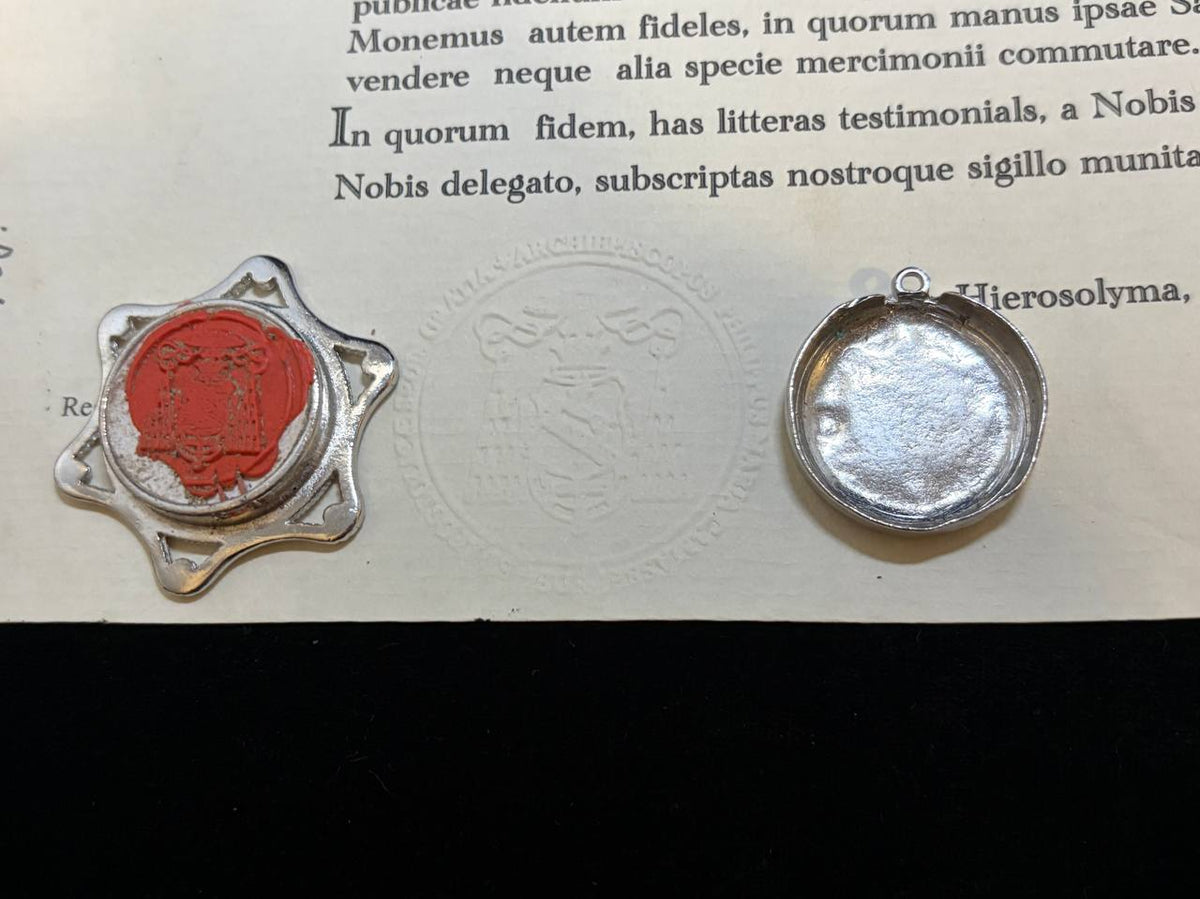 Red wax seal on the back of the Saint Patrick star theca beside the certificate
