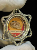 Saint Patrick of Ireland relic in a silver star-shaped theca, label S. Patricii Hiben. Ep., held in a white glove