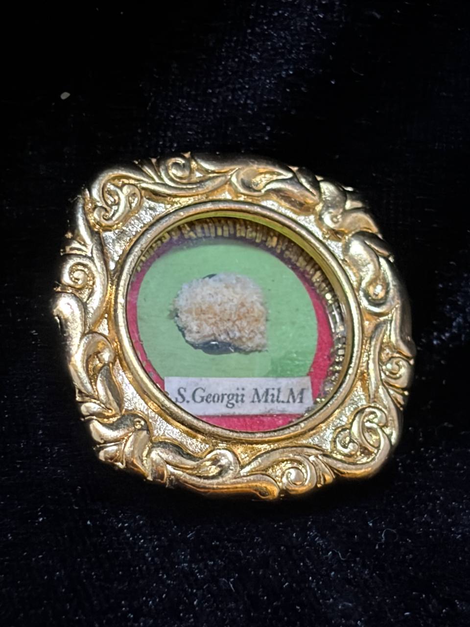 Saint George the Martyr relic in an ornate gilt scroll-frame theca, label S. Georgii M., angled view