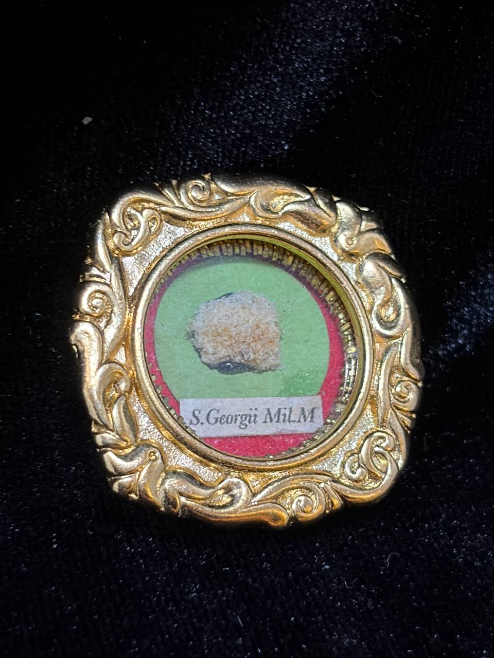 Saint George the Martyr relic in an ornate gilt scroll-frame theca, label S. Georgii M., side angle