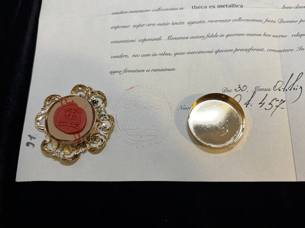 Red wax seal on the True Cross certificate beside the back of the gilt theca