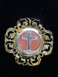 True Cross relic set in a cross shape on red silk in an ornate gilt and silver theca