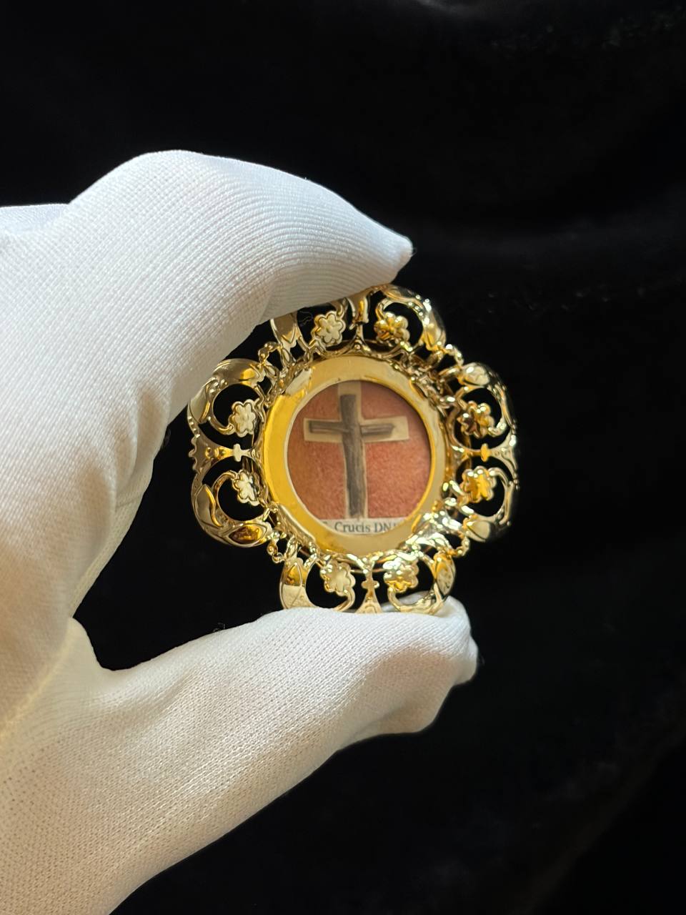 True Cross relic theca shown upright in a white glove