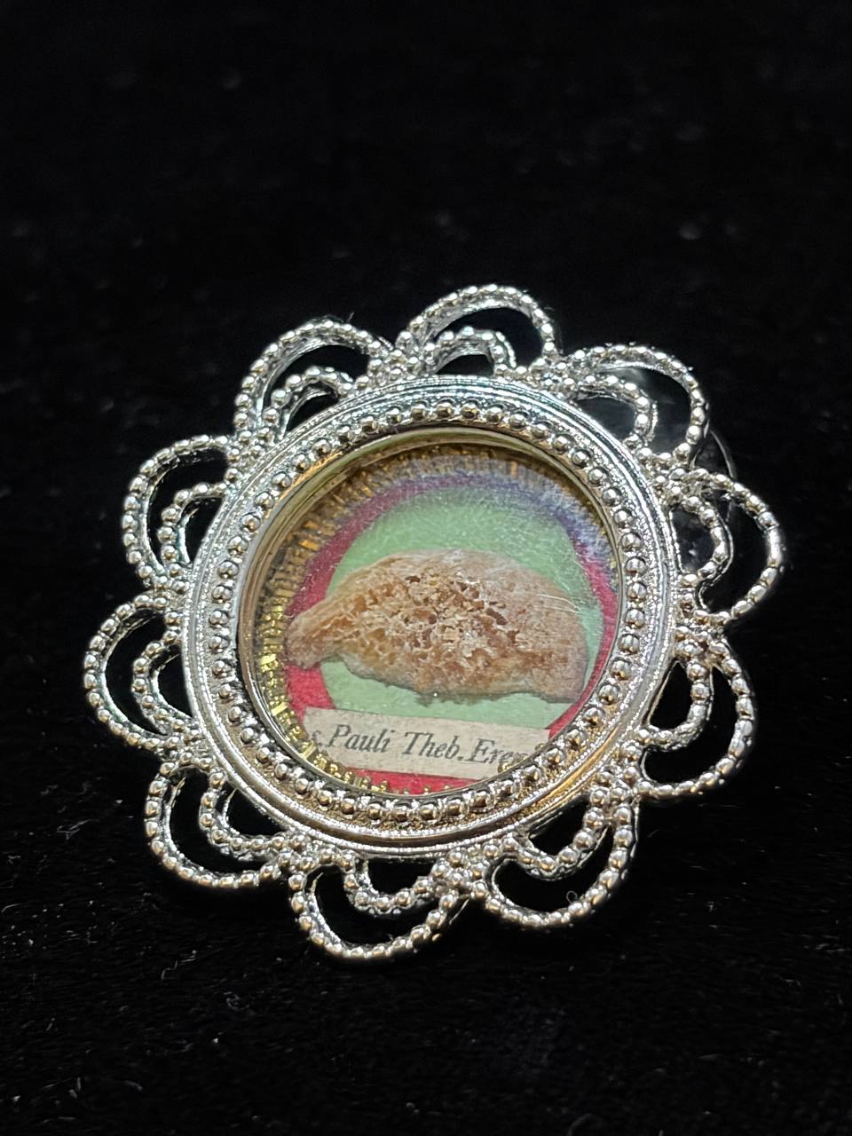 Saint Paul of Thebes relic theca, front view showing the relic on green and red silk