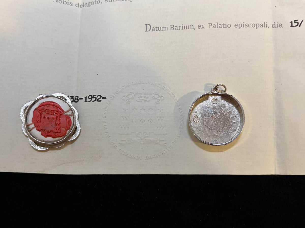 Red wax seal dated 1952 on the Saint Stephen certificate beside the back of the silver theca