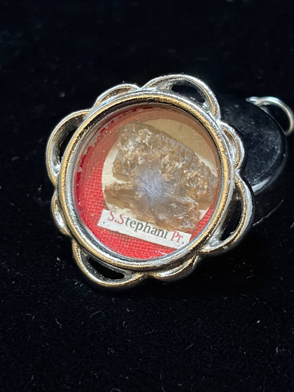 Saint Stephen relic theca with its suspension ring, on black velvet