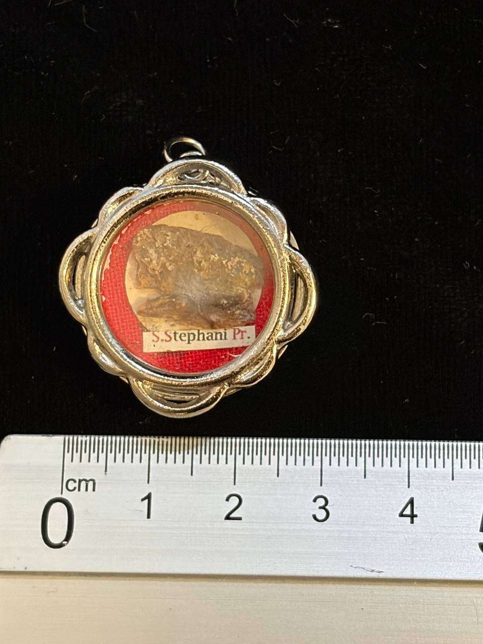 Saint Stephen relic theca next to a ruler, about 3 cm across