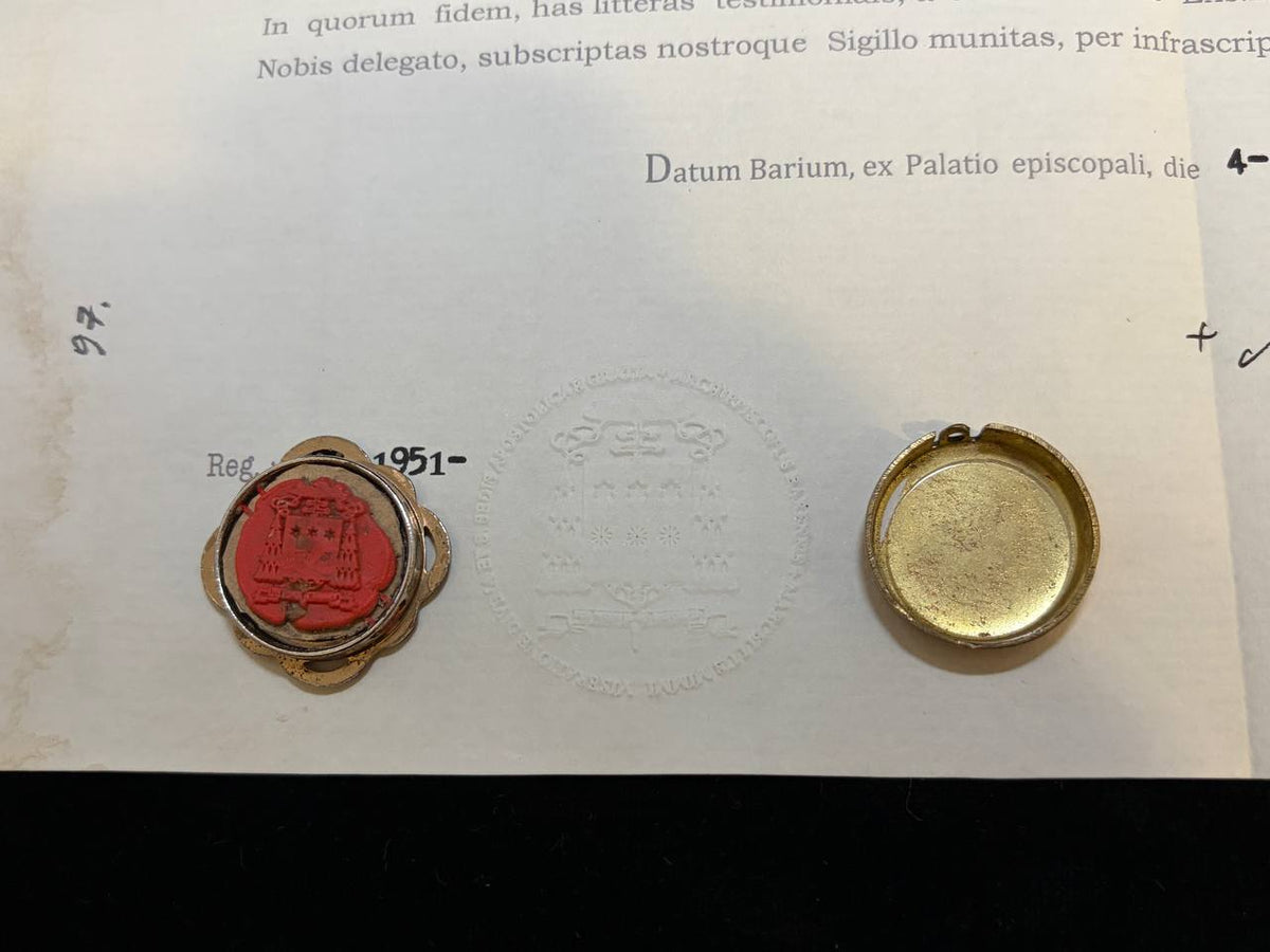 Red wax seal dated 1951 on the Saint Tryphon certificate beside the back of the gilt theca