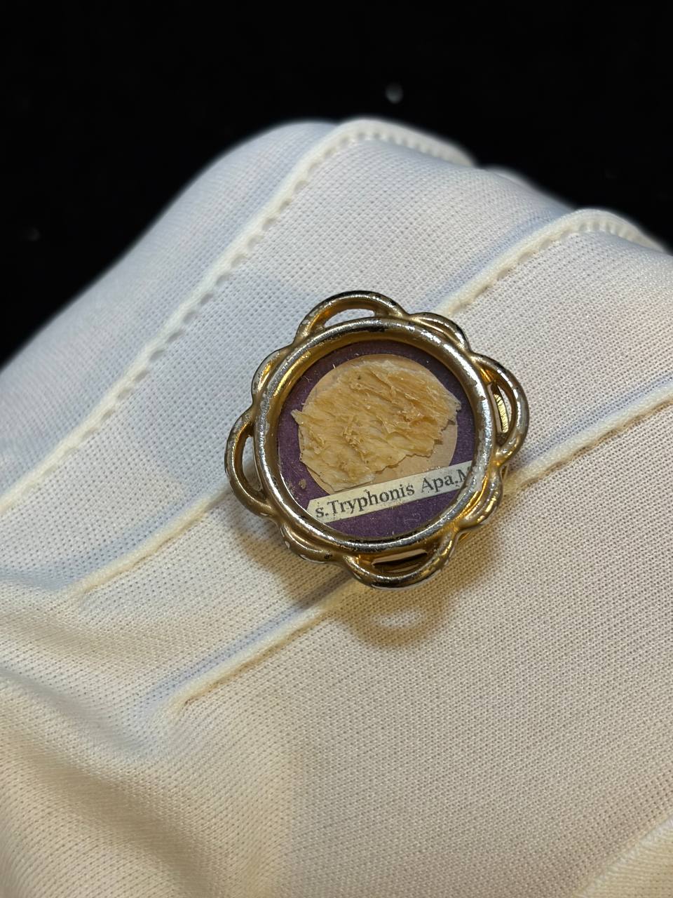 Gilt theca with relic of Saint Tryphon of Apamea held in a white glove