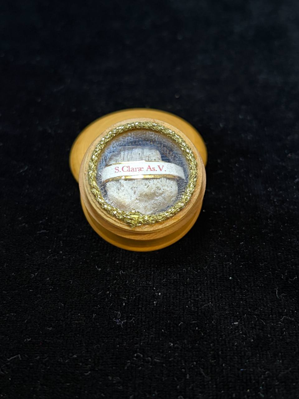 Saint Clare of Assisi relic theca, front view on black velvet