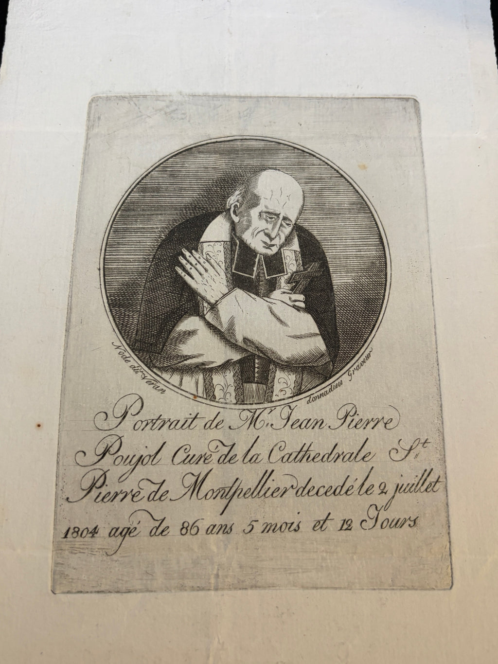 Close-up of the Poujol memorial etching with engraved inscription and signatures Node dit Veran and Donnadieu Graveur