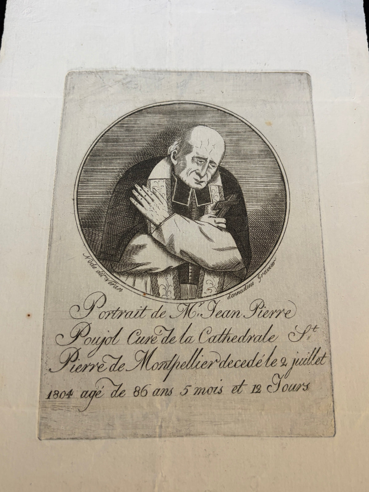 Close-up of the Poujol memorial etching with engraved inscription and signatures Node dit Veran and Donnadieu Graveur