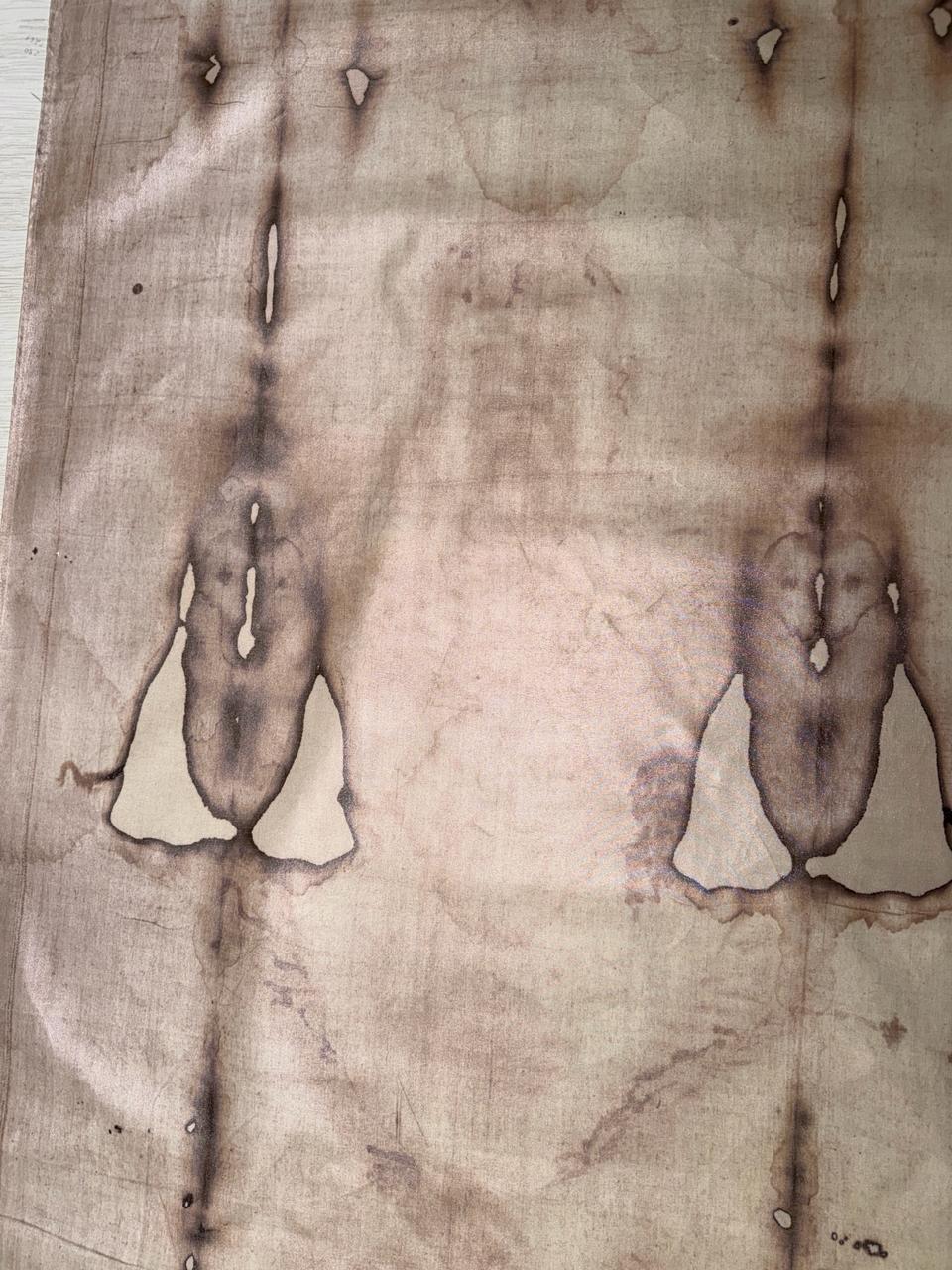 Detailed view of the linen surface, creases and visible marks on the Shroud reproduction
